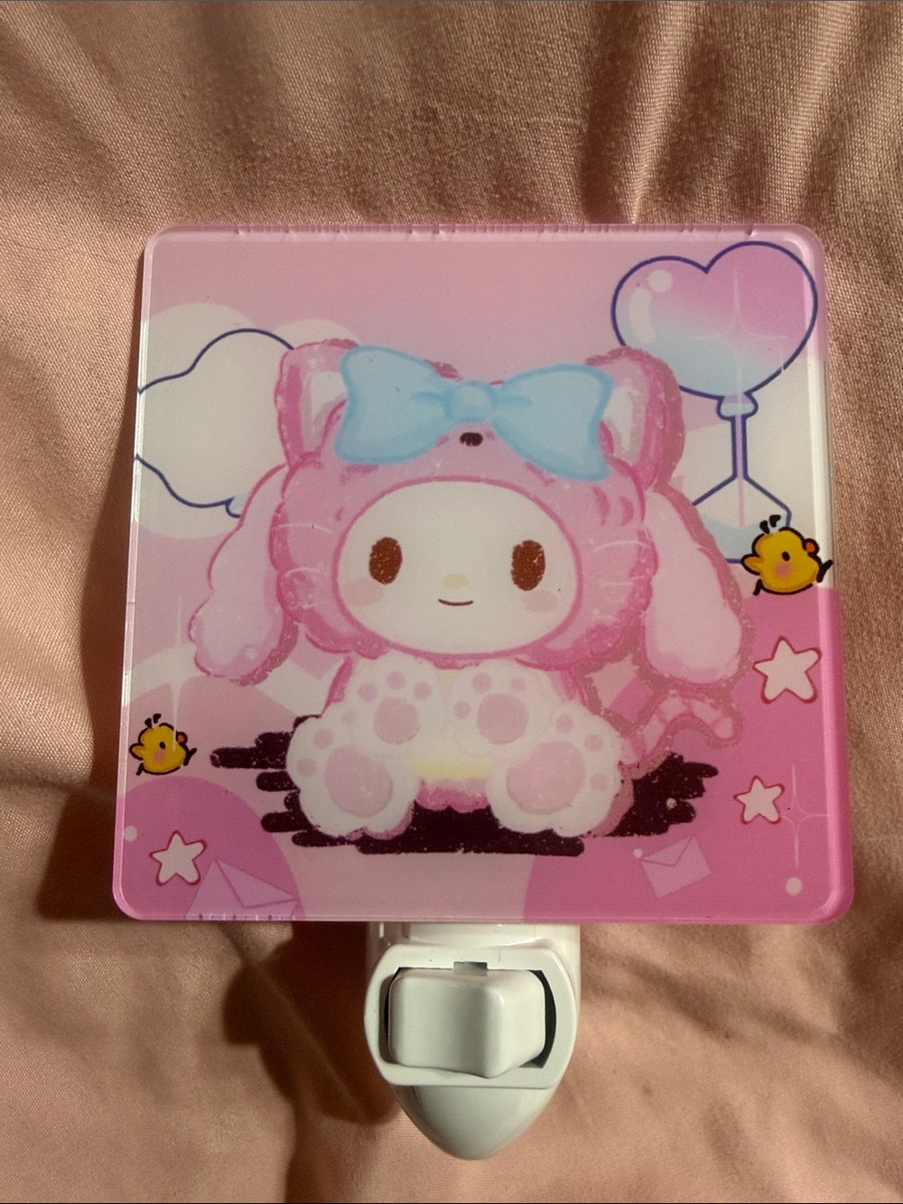 Pink Melody plug in night light.  Does not include bulb.